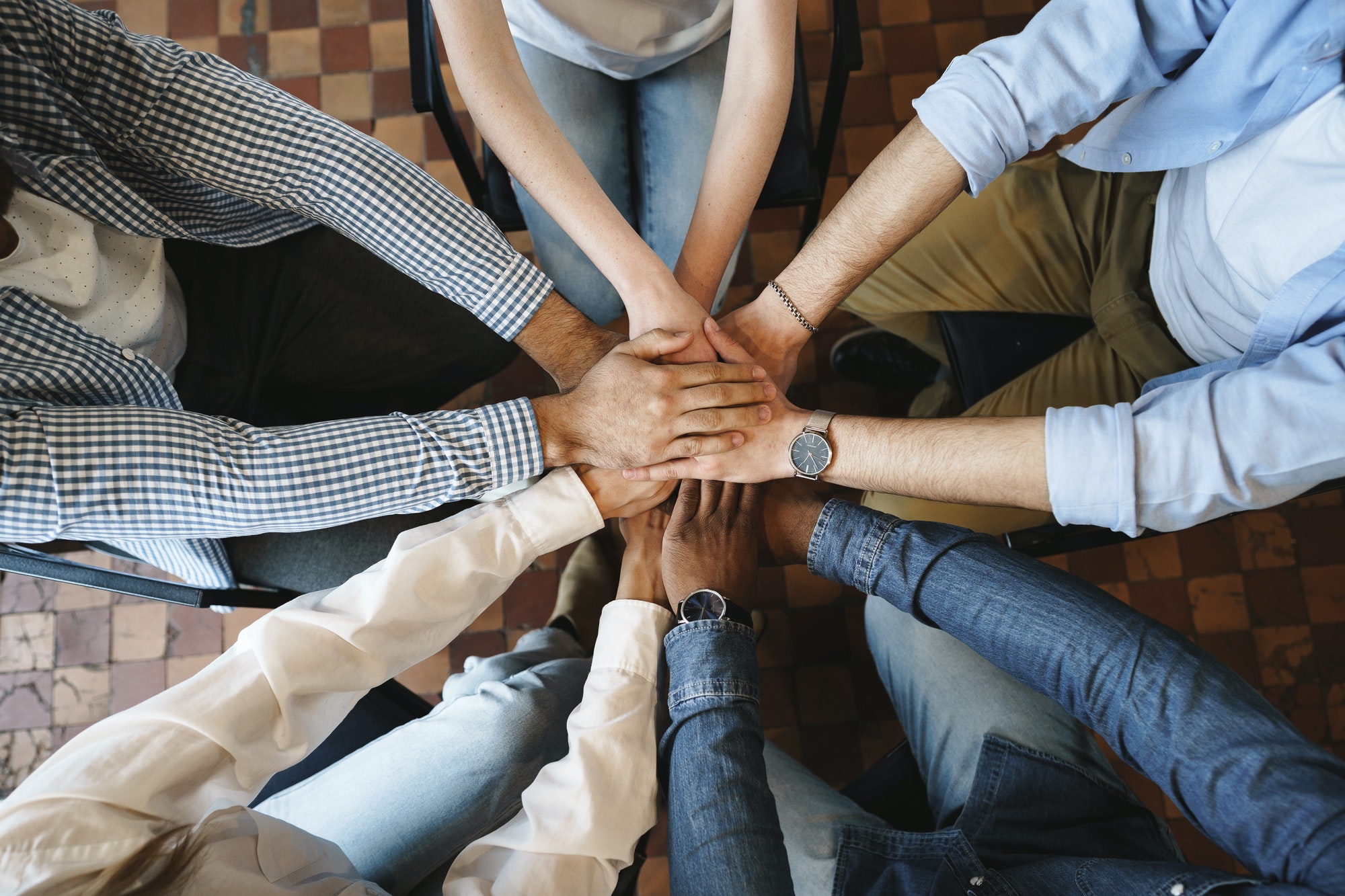 top-view-of-diverse-people-hands-holding-together-in-circle-hands-stack